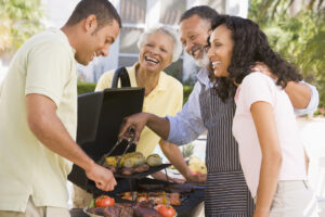 Family Enjoying A Barbeque